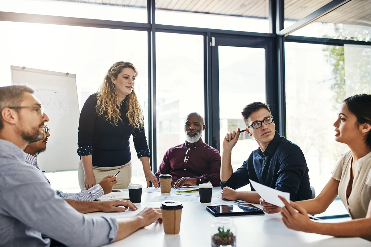 A business team having a team offsite in a purpose-built meeting room